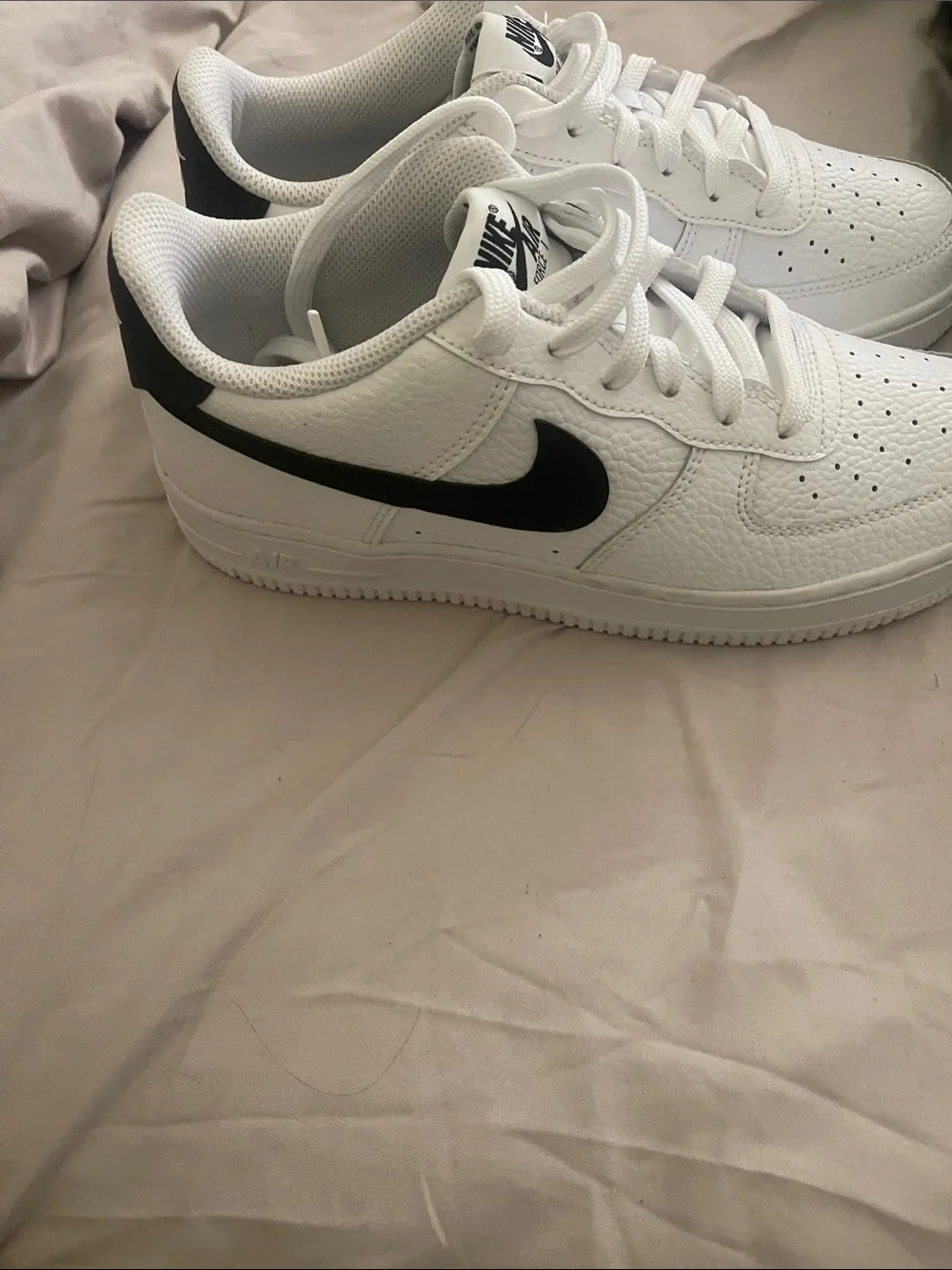 Nike White Low-Top Sneakers with Black Logo